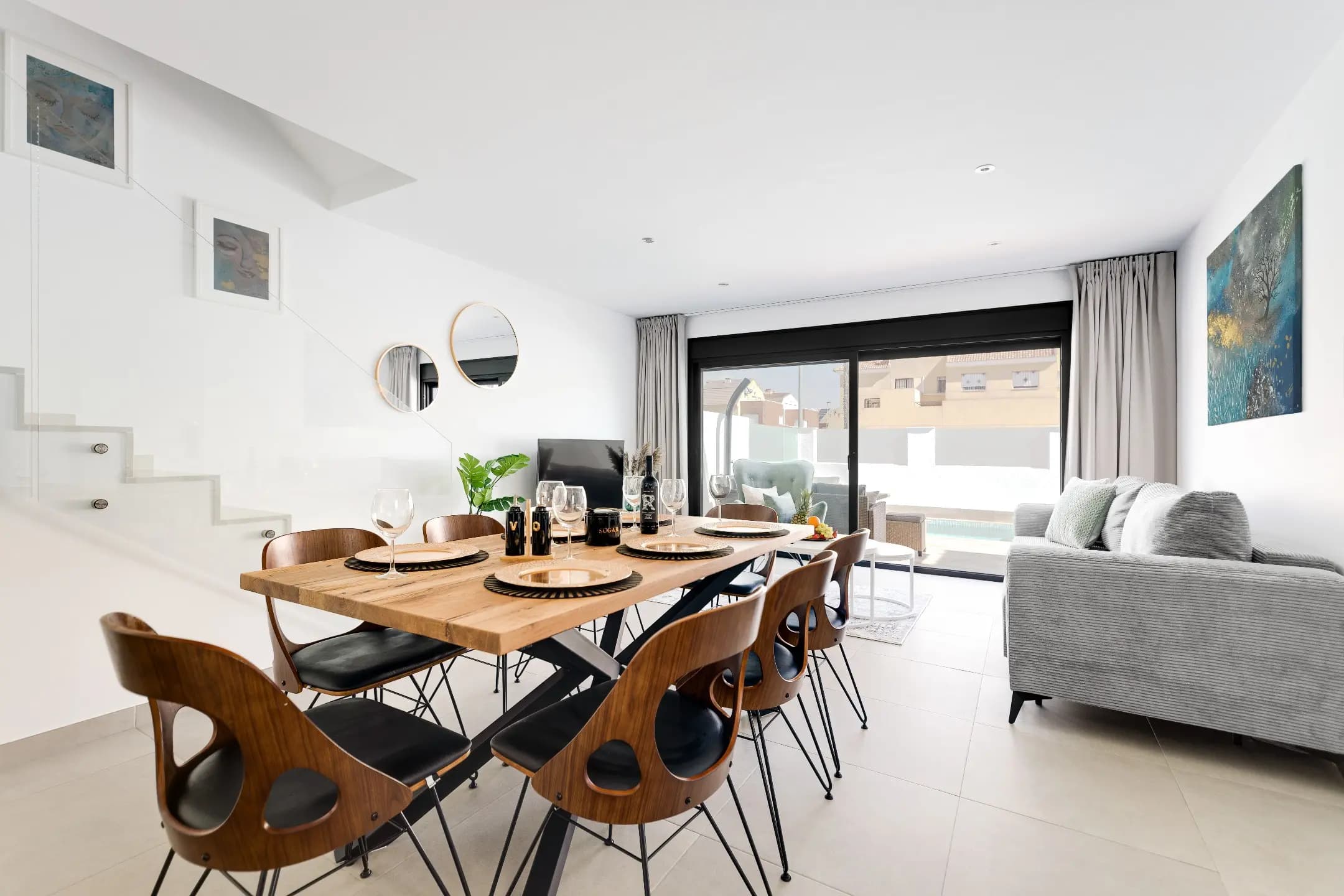 Clean and modern dining room setup with elegant furniture.